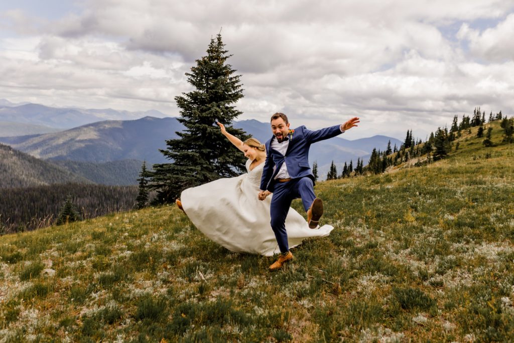 bride and groom dancing in alpine meadows manning park