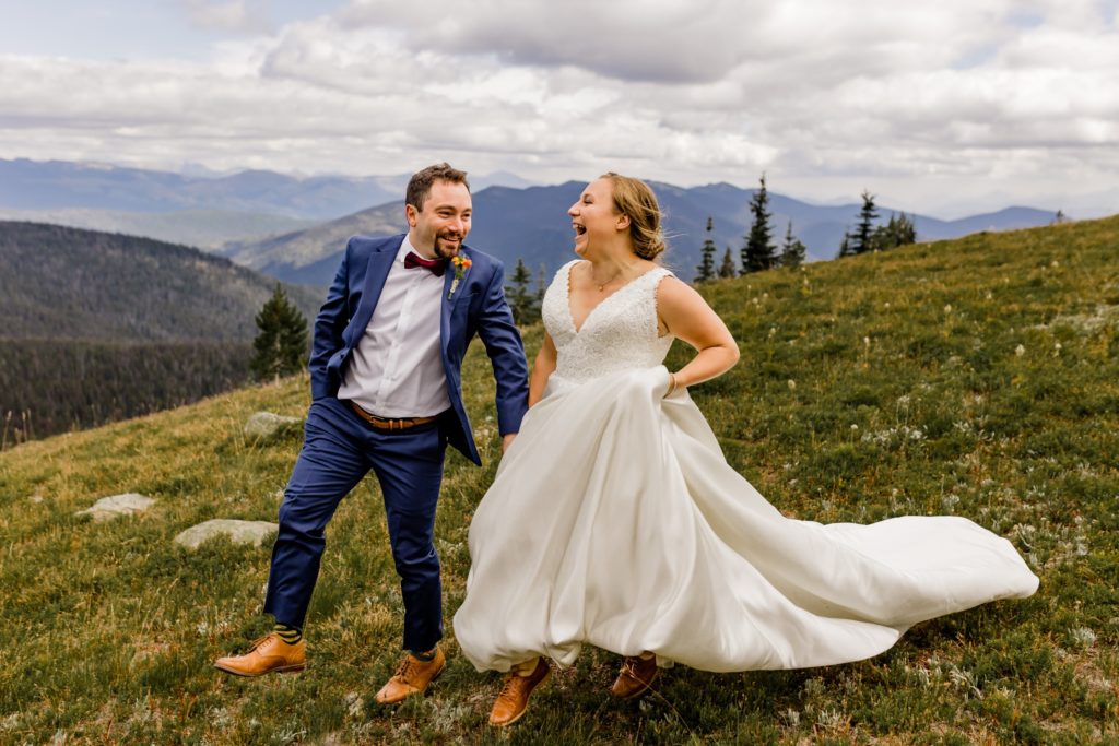bride and groom frolicing in alpine meadows manning park