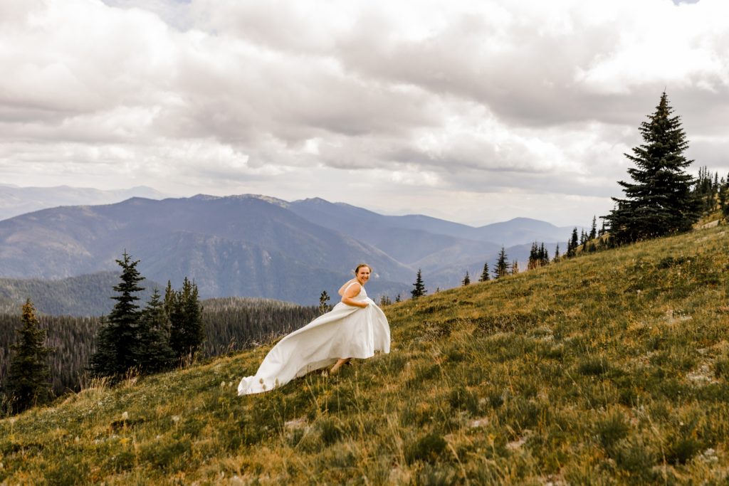 bride running in alpine meadows manning park