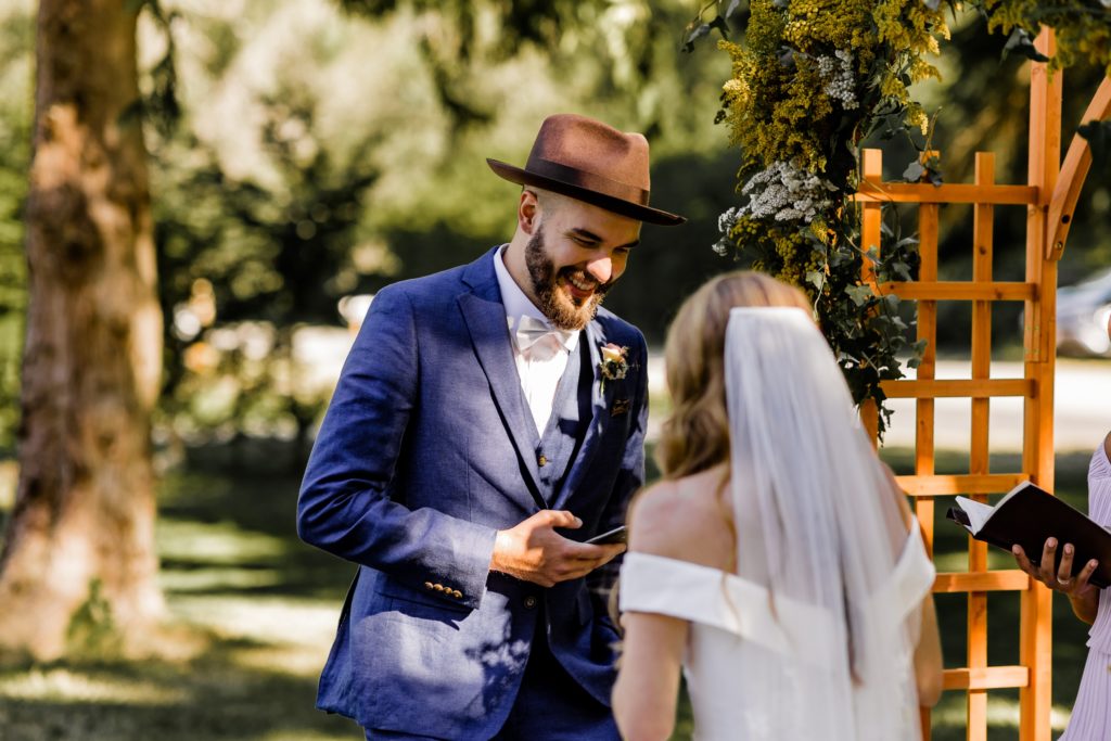 groom laughs as he gives his vows 

