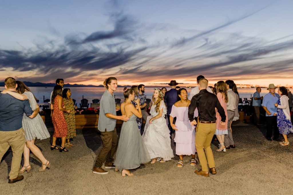 sun sets as the guests dance on the dancefloor